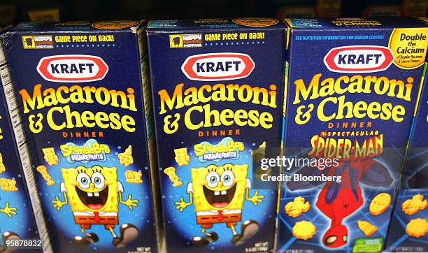 Boxes of Kraft Foods Inc. Macaroni & Cheese sit on a shelf in a grocery store in Glenview, Illinois, U.S., on Tuesday, Jan. 19, 2010. Cadbury Plc...