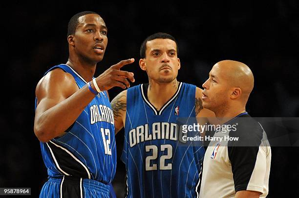 Dwight Howard and Matt Barnes of the Orlando Magic talk to referee Marc Davis during the game against the Los Angeles Lakers on January 18, 2010 at...
