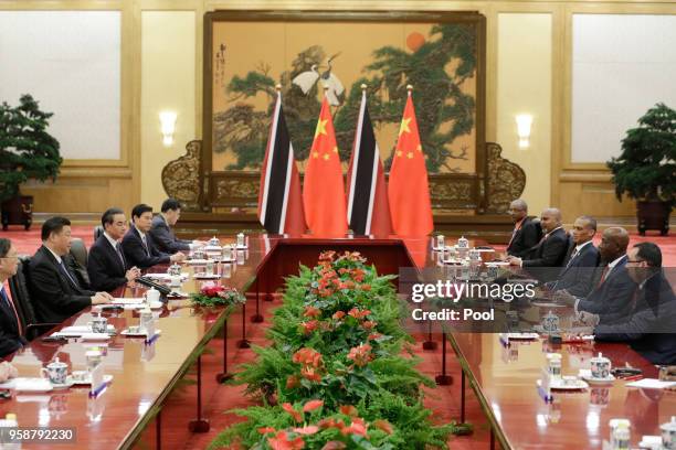 China's Premier Li Keqiang speaks to Trinidad and Tobago Prime Minister Keith Rowley during a signing ceremony at the Great Hall of the People on May...