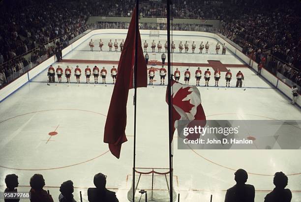 The Summit Series: Overall view of Team Canada and Team Soviet Union lining up during national anthem before Game 3 at Winnipeg Arena. View of flags....