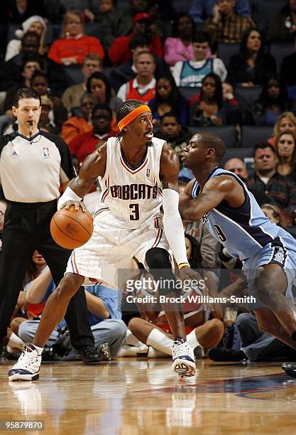 Gerald Wallace of the Charlotte Bobcats posts up against Ronnie Brewer of Utah Jazz during the game at Time Warner Cable Arena on December 19, 2009...