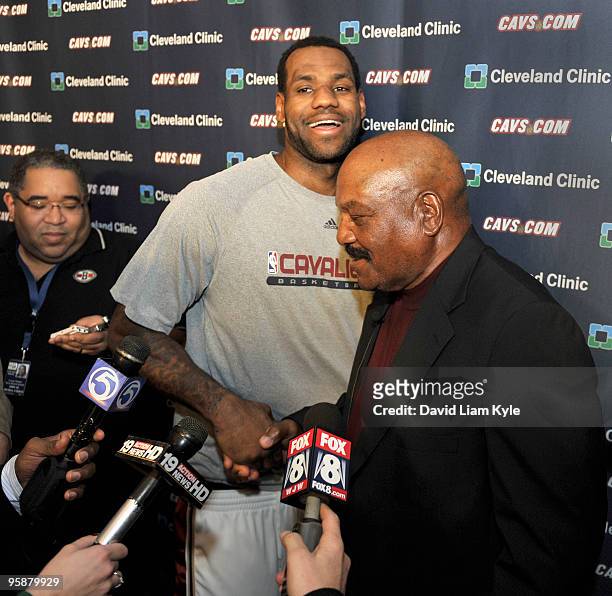 LeBron James of the Cleveland Cavaliers welcomes Cleveland Brown legend Jim Brown on Dr. Martin Luther King Jr. Tribute Night prior to the game...