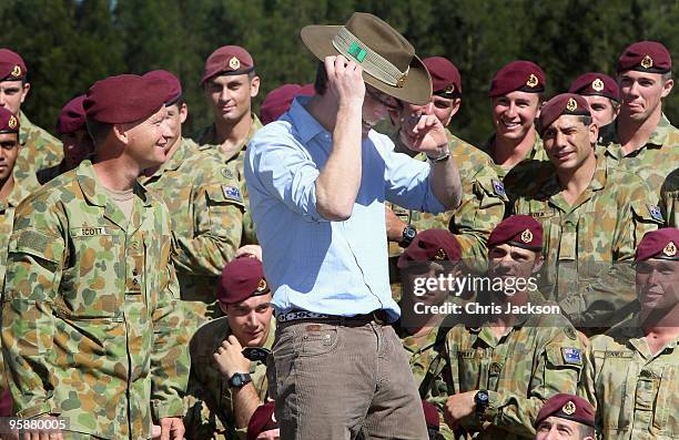 Prince William trys on a Slouch hat given to him by the 3rd Royal Australian Regiment at Holsworthy Army Barracks on the second day of his visit to...