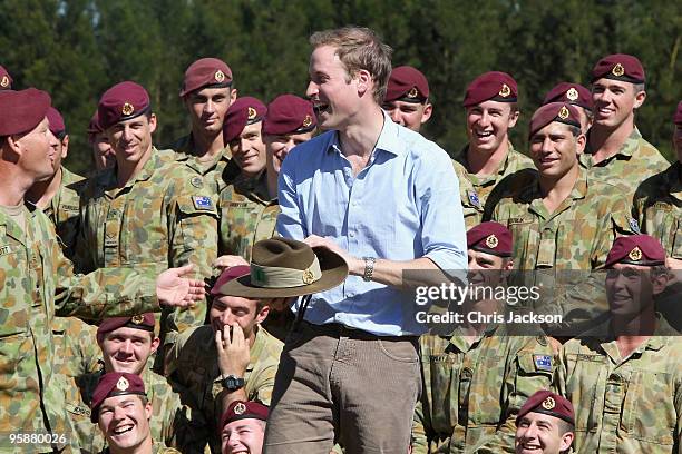 Prince William holds a Slouch hat given to him by the 3rd Royal Australian Regiment at Holsworthy Army Barracks on the second day of his visit to...