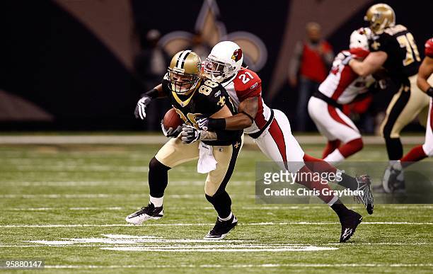 Jeremy Shockey of the New Orleans Saints runs for yards after the catch against Antrel Rolle of the Arizona Cardinals during the NFC Divisional...