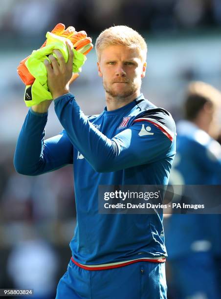 Stoke City goalkeeper Jakob Haugaard applauds the fans at the end of the Premier League match at the Liberty Stadium, Swansea