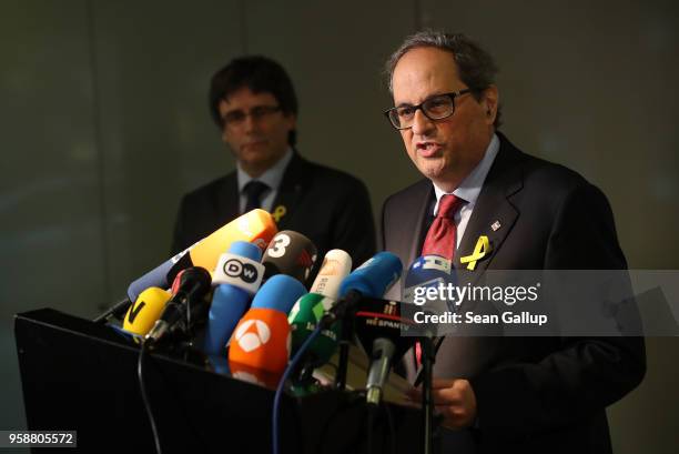 Former Catalan separitist leader Carles Puigdemont and newly-elected Catalan leader Quim Torra speak to the media on May 15, 2018 in Berlin, Germany....