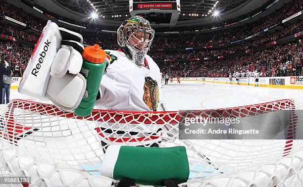 Cristobal Huet of the Chicago Blackhawks puts his water bottle in its holster after player introductions prior to a game against at Scotiabank Place...