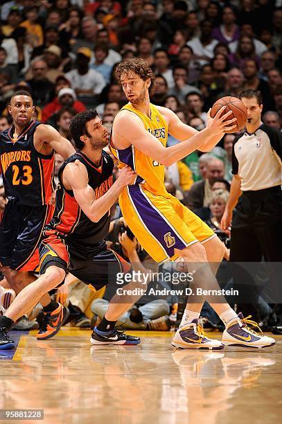 Pau Gasol of the Los Angeles Lakers goes up against Vladimir Radmanovic of the Golden State Warriors during the game on December 29, 2009 at Staples...