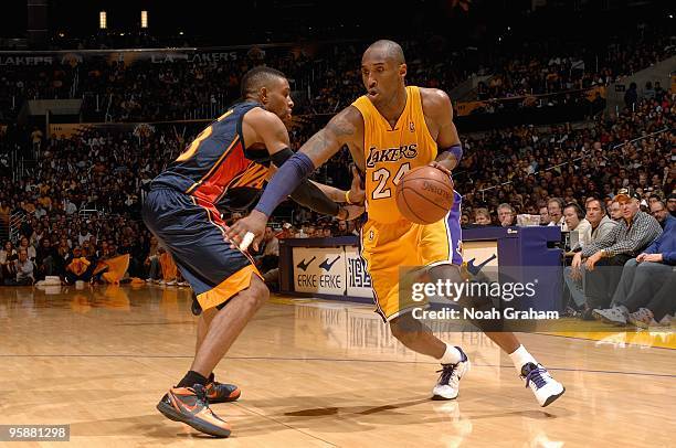 Kobe Bryant of the Los Angeles Lakers drives to the basket around C.J. Watson of the Golden State Warriors during the game on December 29, 2009 at...