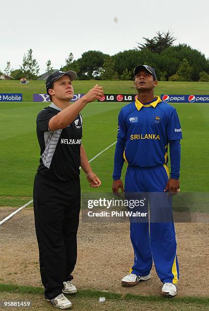 Chathura Pieris of Sri Lanka and Craig Cachopa of New Zealand toss the coin before the ICC U19 Cricket World Cup match between New Zealand and Sri...