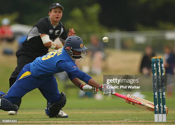 Dhanishka Gunathilake of Sri Lanka dives in to make his ground as Craig Cachopa of New Zealand throws in the ball during the ICC U19 Cricket World...