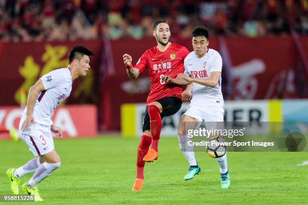 Guangzhou Midfielder Nemanja Gudelj fights for the ball with Tianjin Forward Zhao Xuri during the AFC Champions League Round of 16 second leg match...