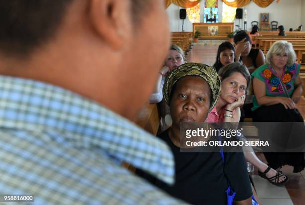 Cesar, an ex-member of the Mara Salvatrucha gang, speaks to missionaries from the United States during a meeting at the poor neighbourhood of Nueva...