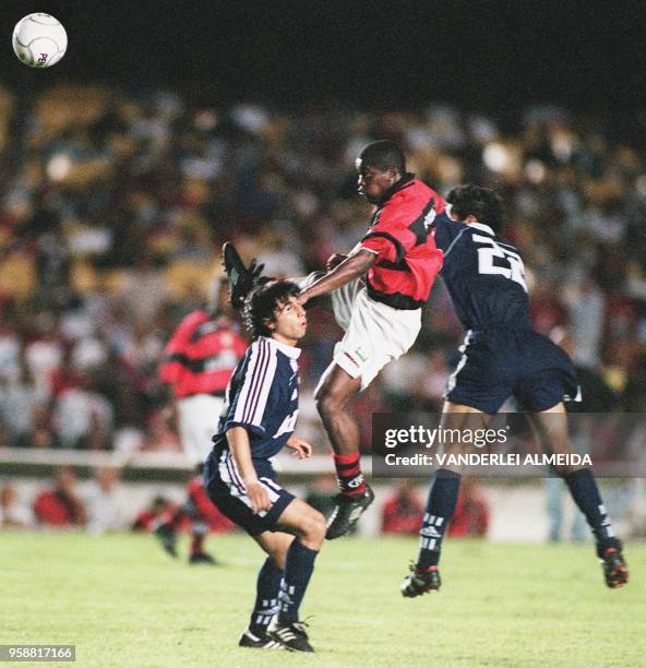 Beto of the Flamengo team fights for the ball with players Galdenes and Gonzalez, in an attempt to win the Mercusor cup, Rio de Janeiro, Brazil, 07...