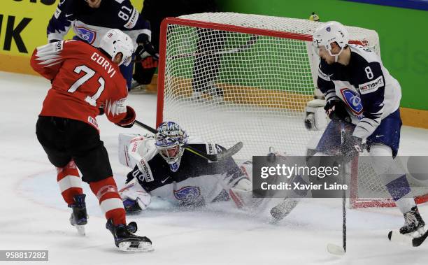Enzo Corvi of Switzerland score a goal over Florian Hardy of France during the 2018 IIHF Ice Hockey World Championship Group A between Switzerland...