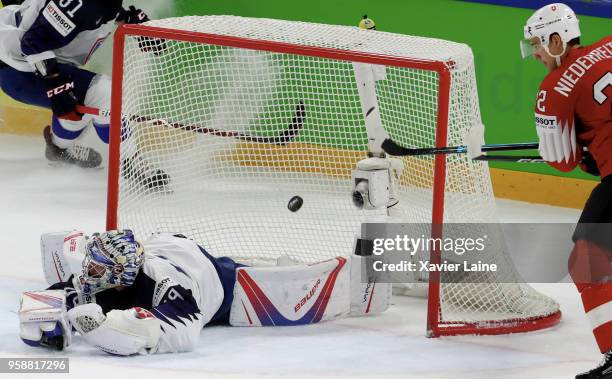 Nino Nierderreiter of Switzerland score a goal over Florian Hardy of France during the 2018 IIHF Ice Hockey World Championship Group A between...