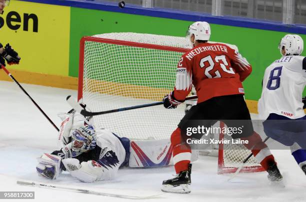 Nino Nierderreiter of Switzerland score a goal over Florian Hardy of France during the 2018 IIHF Ice Hockey World Championship Group A between...