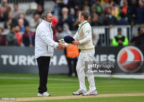 Dublin , Ireland - 15 May 2018; Ireland captain William Porterfield shakes hands with umpire Richard Illingworth following play on day five of the...