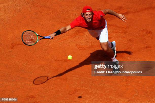 Lucas Pouille of France returns a forehand in his match against Andreas Seppi of Italy during day 3 of the Internazionali BNL d'Italia 2018 tennis at...