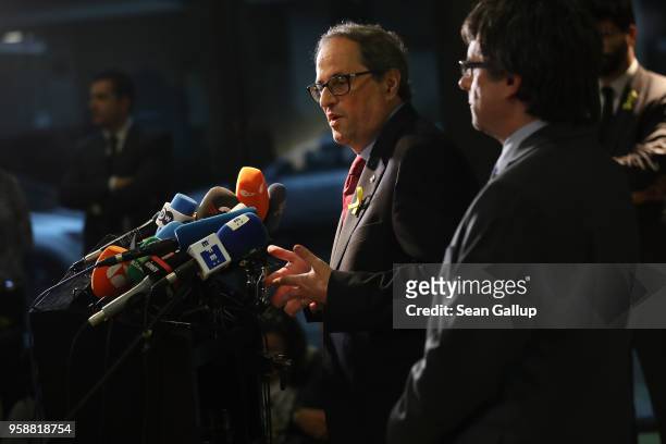 Newly-elected Catalan leader Quim Torra and former Catalan separitist leader Carles Puigdemont speak to the media on May 15, 2018 in Berlin, Germany....