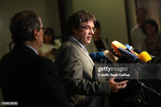 Newly-elected Catalan leader Quim Torra and former Catalan separitist leader Carles Puigdemont speak to the media on May 15, 2018 in Berlin, Germany....