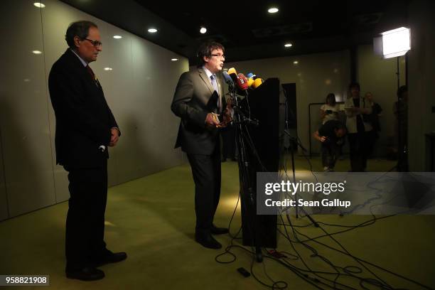 Newly-elected Catalan leader Quim Torra and former Catalan separitist leader Carles Puigdemont speak to the media on May 15, 2018 in Berlin, Germany....