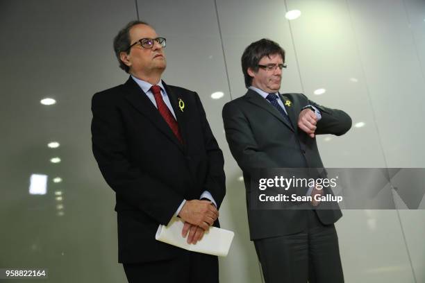 Newly-elected Catalan leader Quim Torra and former Catalan separitist leader Carles Puigdemont arrive to speak to the media on May 15, 2018 in...