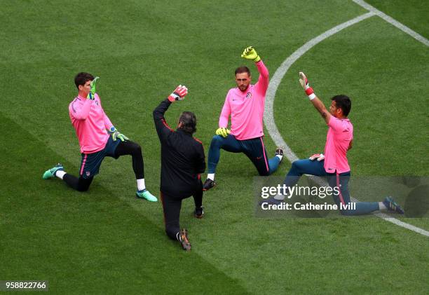 Jan Oblak of Atletico Madrid warms up with fellow goalkeepers during a Club Atletico de Madrid training session ahead of the the UEFA Europa League...