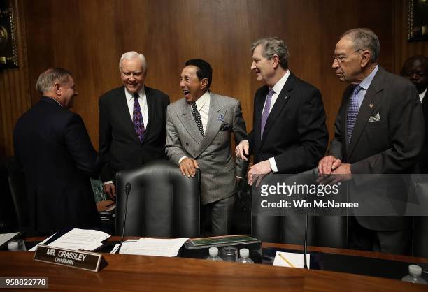 Singer and songwriter Smokey Robinson greets members of the Senate Judiciary Committee prior to a hearing May 15, 2018 in Washington, DC. Robinson...