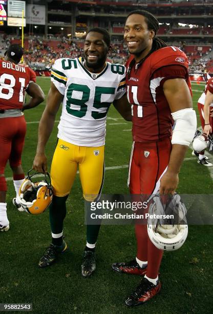 Greg Jennings of the Green Bay Packers and Larry Fitzgerald of the Arizona Cardinals pose together following the NFL game at the Universtity of...