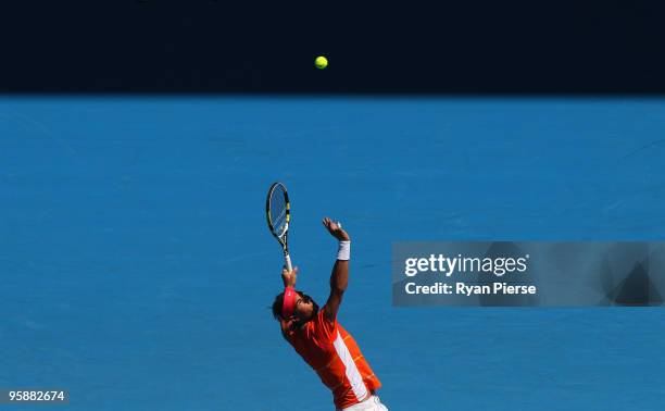 Rafael Nadal of Spain serves in his second round match against Lukas Lacko of Slovakia during day three of the 2010 Australian Open at Melbourne Park...