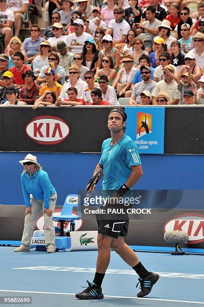 Fernando Gonzalez of Chile looks up the crowd after taking match point against Marsel Ilhan of Turkey in their men's singles second round match on...