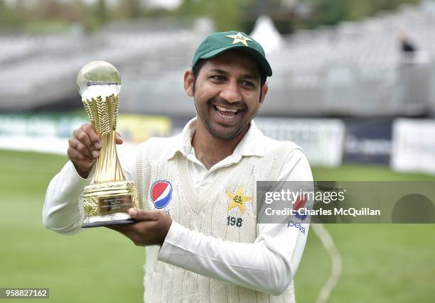 The Pakistan cricket team captain Sarfraz Ahmed poses with the match trophy after victory on the fifth day of the international test cricket match...