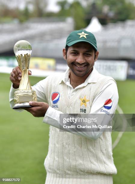 The Pakistan cricket team captain Sarfraz Ahmed poses with the match trophy after victory on the fifth day of the international test cricket match...