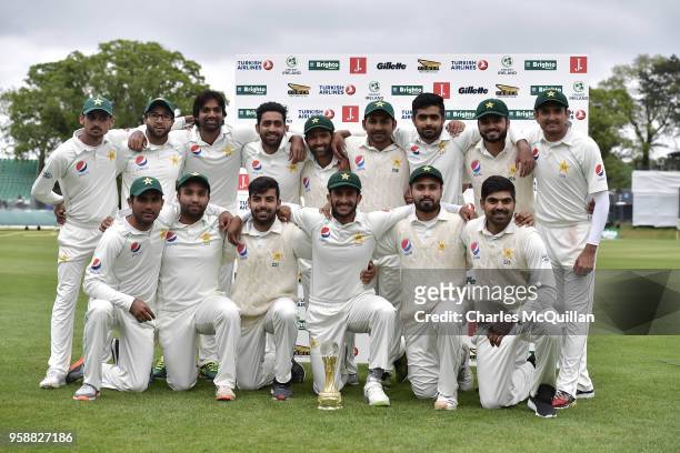 The Pakistan cricket team pose with the match trophy after defeating Ireland on the fifth day of the international test cricket match between Ireland...