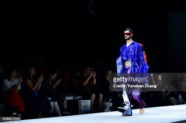 Model showcases designs on the runway at the Changzhou Vocational Institute Of Textile And Garment Show during the day 3 of China Graduate Fashion...