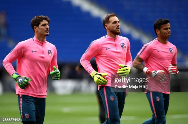 Goalkeepers Axel Werner, Jan Oblak and Alejandro dos Santos Ferreira warm up during a Club Atletico de Madrid training session ahead of the the UEFA...