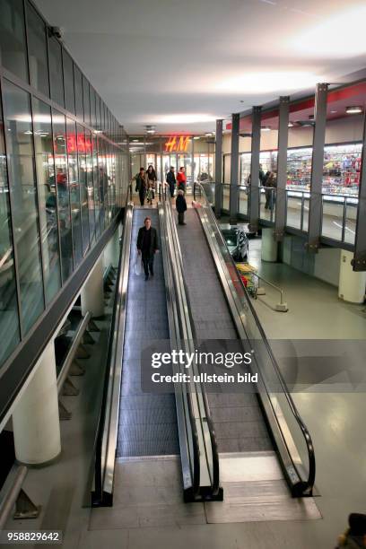 Subterranean entrance area at the shopping center Mosae Forum in Maastricht with moving walkway.