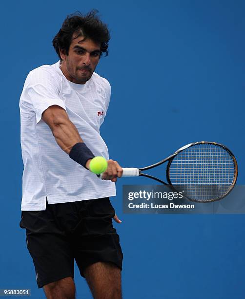 Rameez Junaid of Australia plays a backhand in his first round doubles match with Peter Luczak of Australia against Jaroslav Levinsky of the Czech...