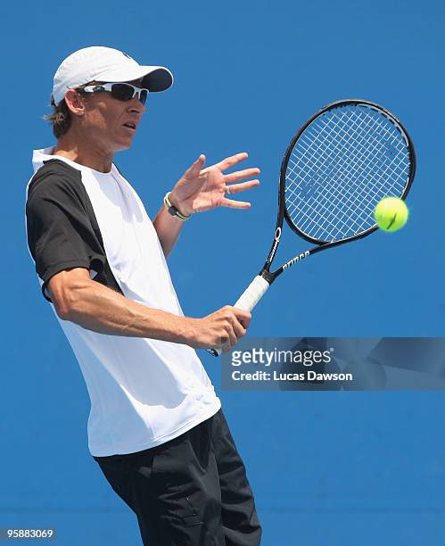 Travis Parrott of the USA plays a backhand in his first round doubles match with Jaroslav Levinsky of the Czech Republic against Rameez Junaid and...