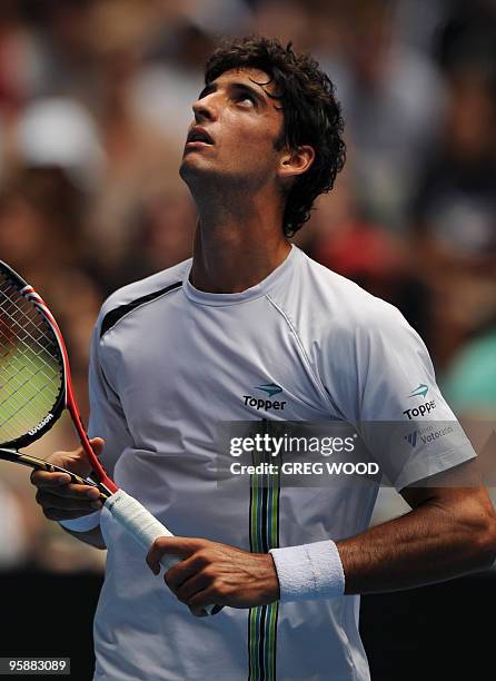 Brazilian tennis player Thomaz Bellucci gestures during his men's singles match against US opponent Andy Roddick on the third day of play at the...