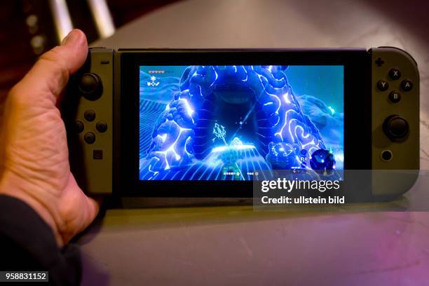 Nintendo Switch video game console with the game Zelda.