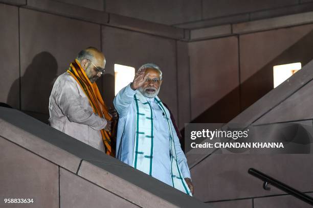 Indian Prime Minister Narendra Modi and Bhartiya Janta Party President Amit Shah arrive at party headquarters during a celebration event ahead of...