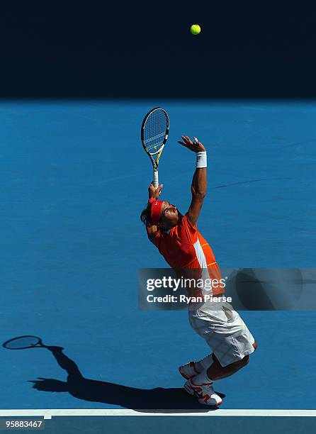 Rafael Nadal of Spain serves in his second round match against Lukas Lacko of Slovakia during day three of the 2010 Australian Open at Melbourne Park...