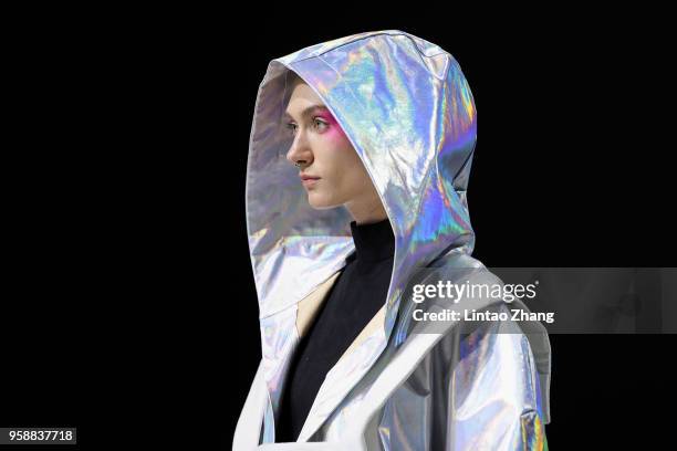 Model showcases designs on runway at Changzhou Vocational Institute Of Textile And Garment show during China International College Student Fashion...