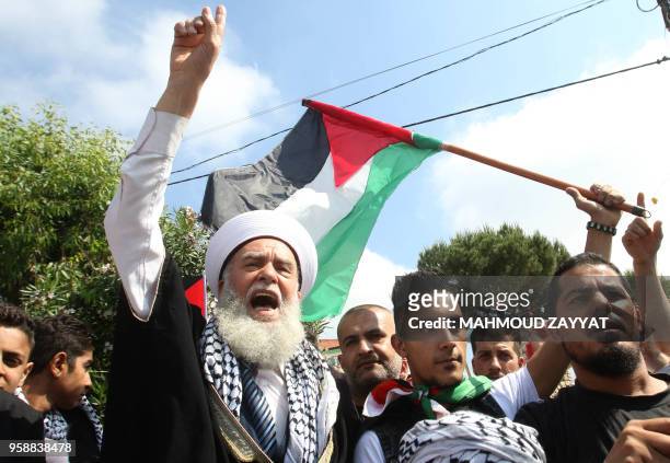 Sunni cleric chants slogans during a demonstration including Lebanese nationals and Palestinian refugees living in Lebanon in the medieval Beaufort...