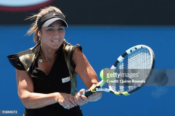 Aravane Rezai of France plays a backhand in her second round match against Angelique Kerber of Germany during day three of the 2010 Australian Open...