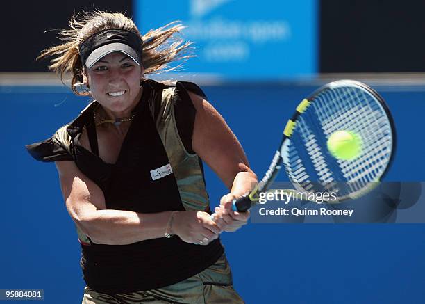 Aravane Rezai of France plays a backhand in her second round match against Angelique Kerber of Germany during day three of the 2010 Australian Open...