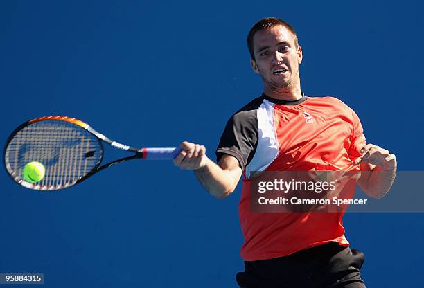 Viktor Troicki of Serbia plays a forehand in his second round match against Florian Mayer of Germany during day three of the 2010 Australian Open at...